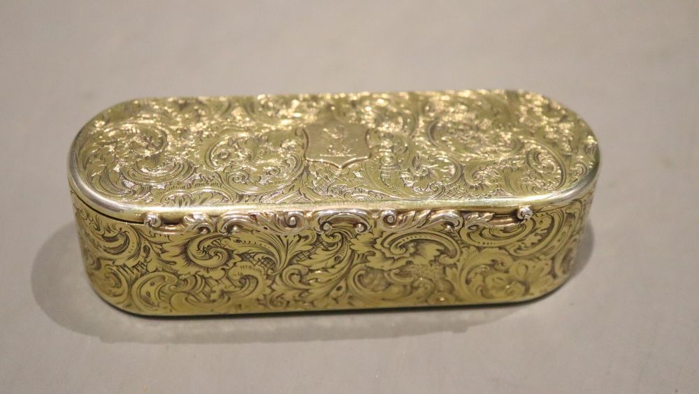 An early Victorian engraved silver gilt oval snuff box, Rawlings & Summers, London, 1837, 98.8 grams.